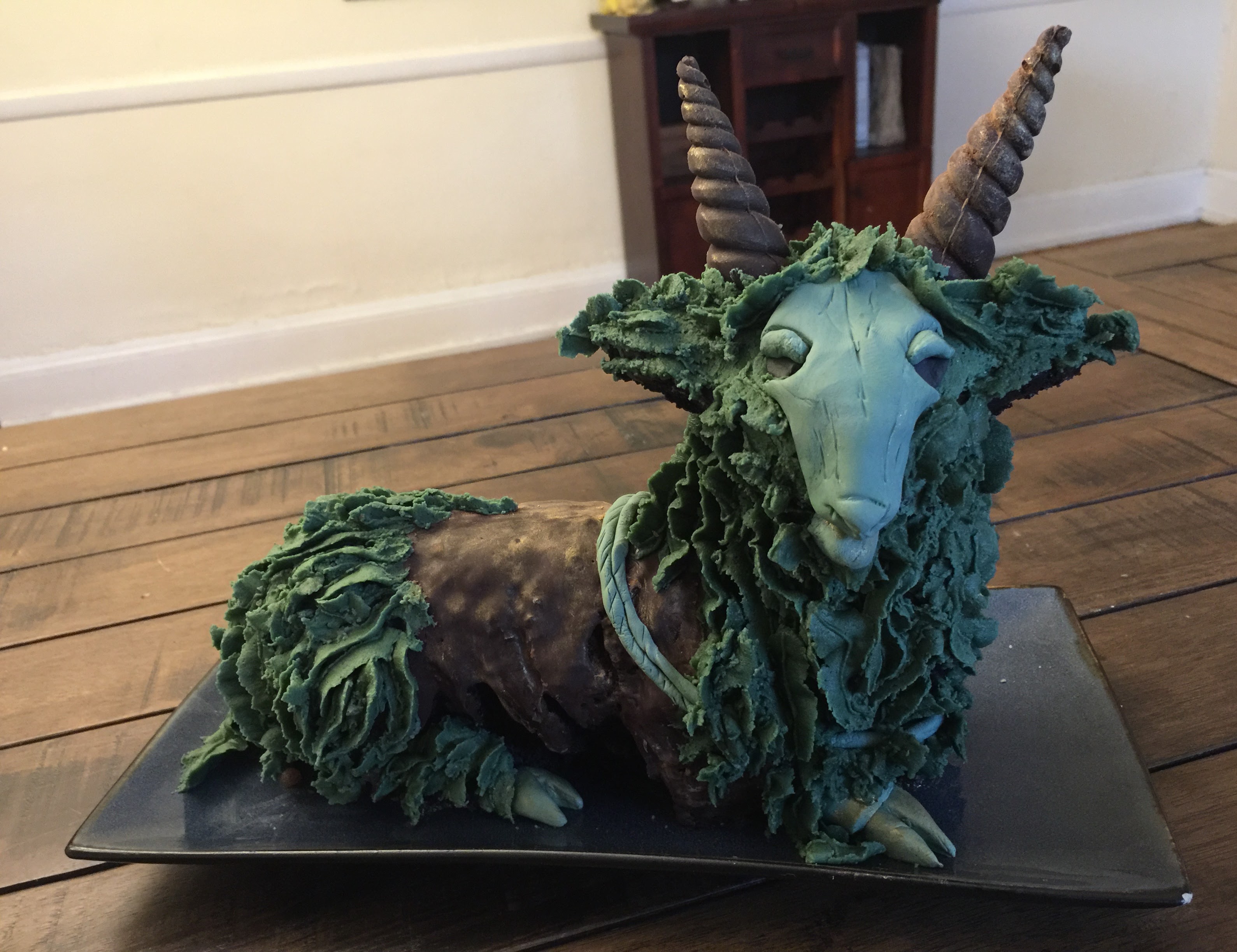 A cake in the shape of Addremelech, rather obviously baked in an easter lamb cake pan.